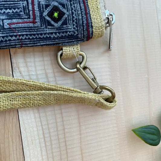 Close-up of tribal strap and hook on indigo hemp pouch
