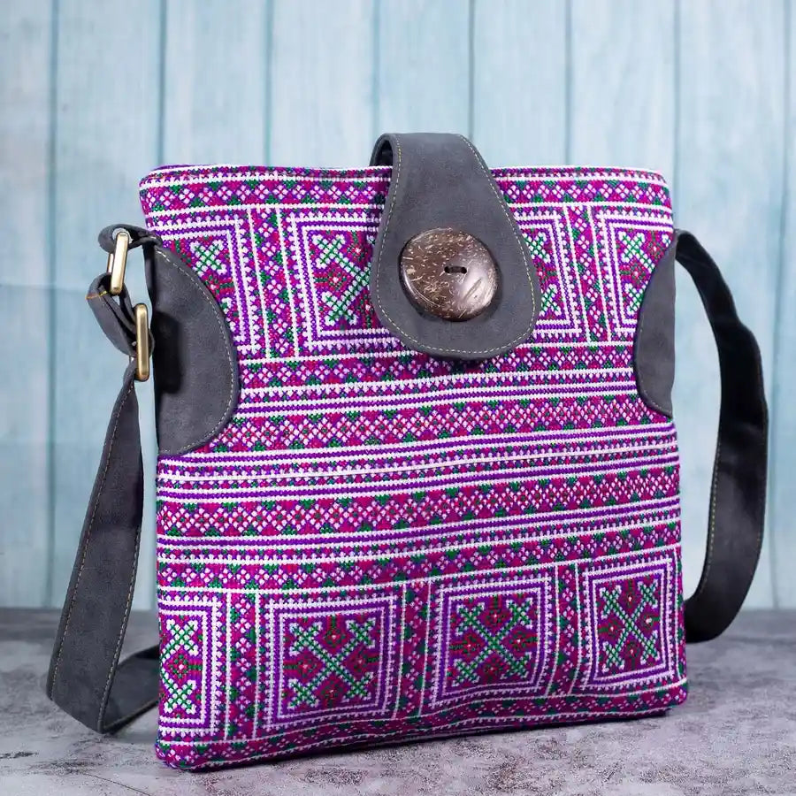 Vindigo purple embroidered crossbody bag side view with grey faux leather strap