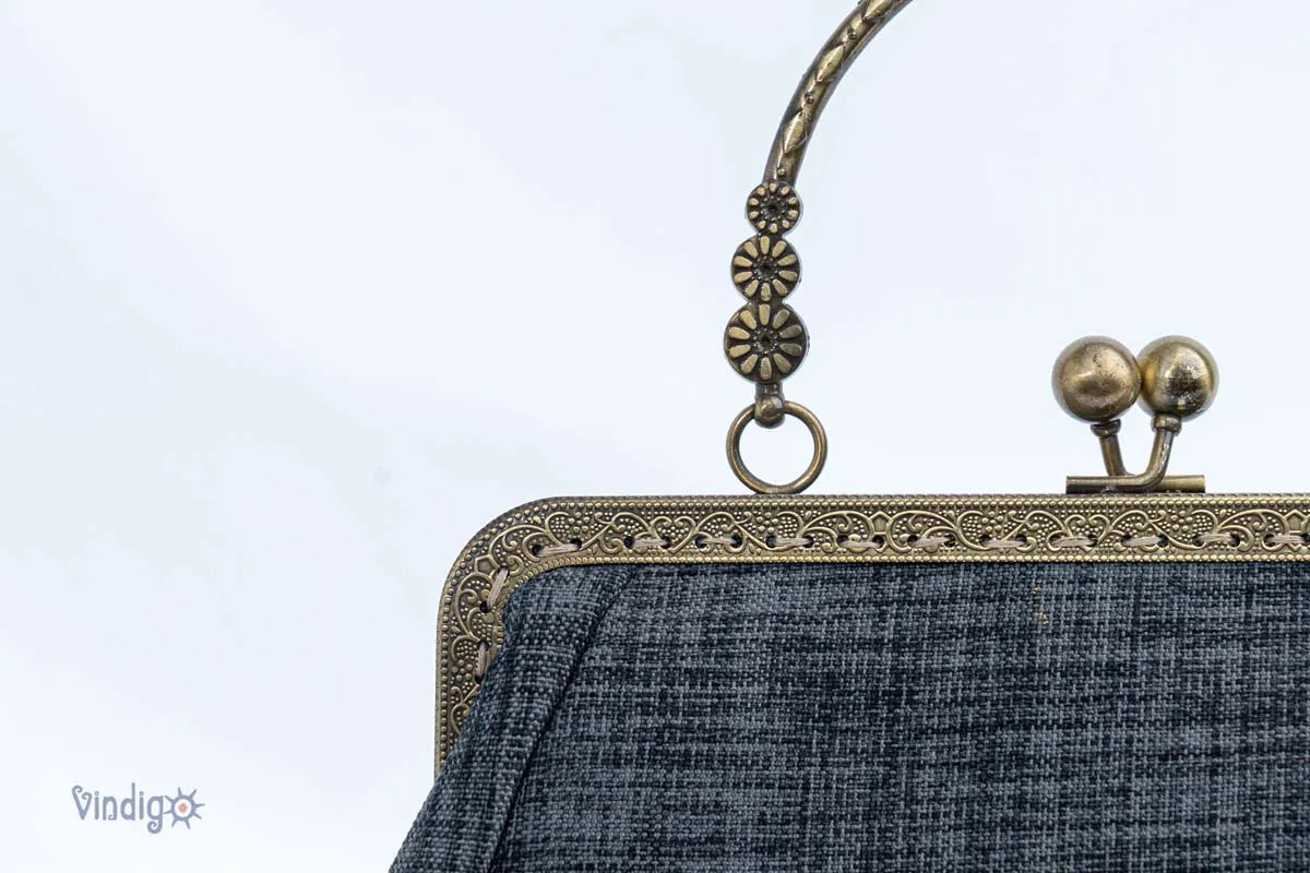 Vindigo handmade black handbag close-up of copper clasp and handle