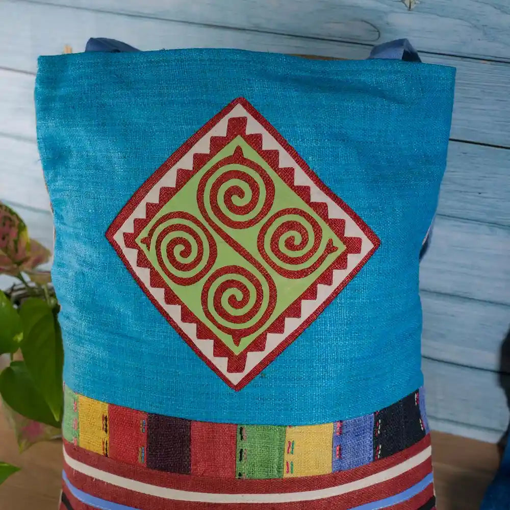 Vindigo tote bag blue hemp with orange spiral embroidery front view