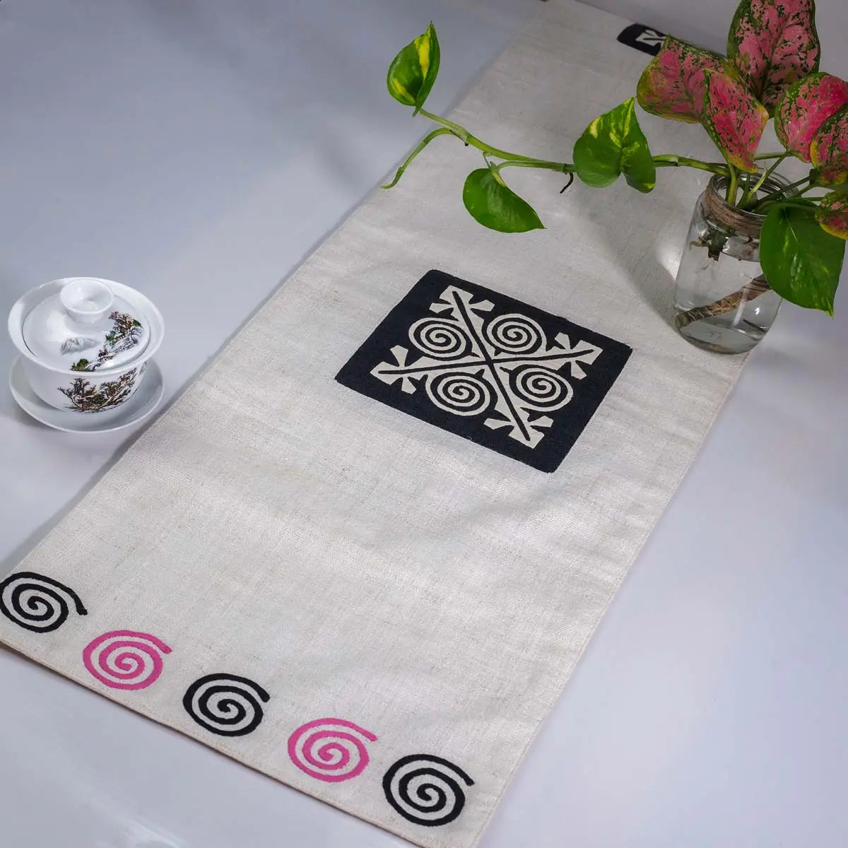 Vindigo beige hemp table runner side angle emphasizing artisan hand-stitching and texture