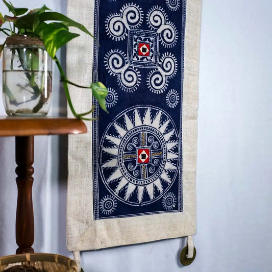 Vindigo indigo hemp batik tapestry beside table and plant