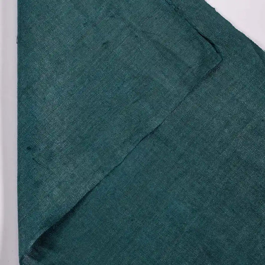 Vindigo plain green hemp fabric showing close texture