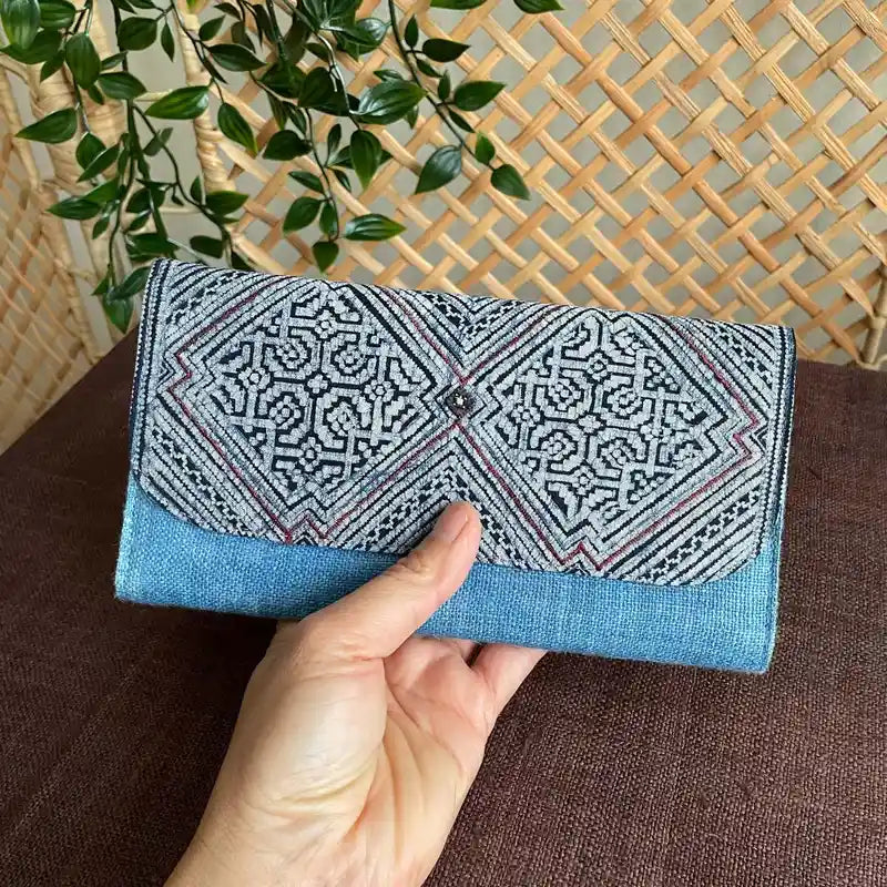 Vindigo long purse denim blue hemp heart pattern front view with hand