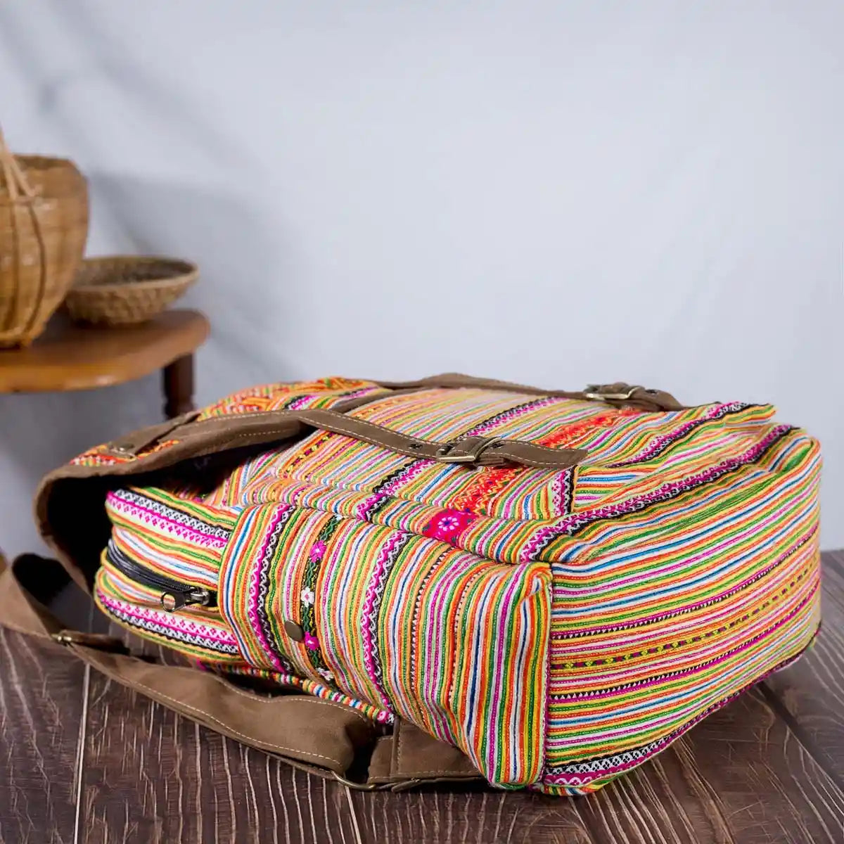 Vindigo orange embroidered cotton backpack angled view