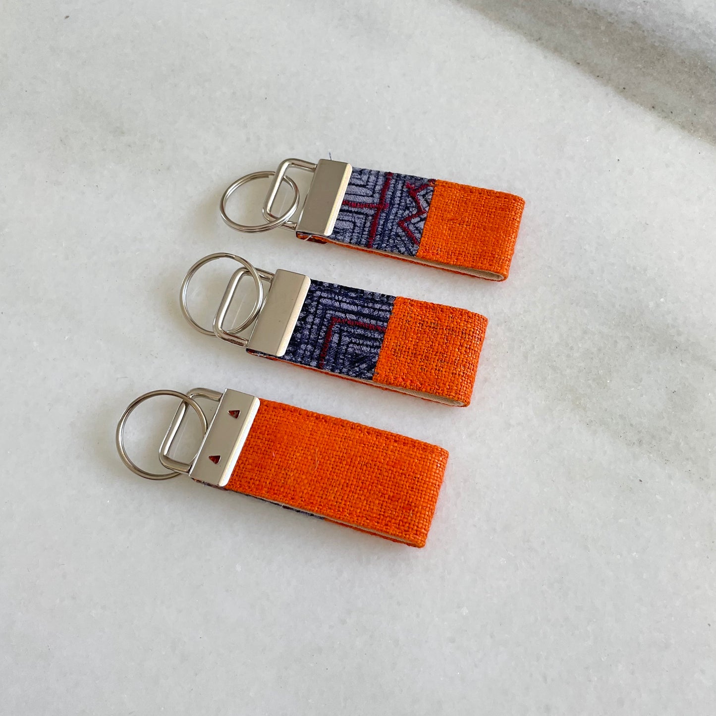 Orange hemp fabric keychain with vintage batik patch, stainless metal key fob