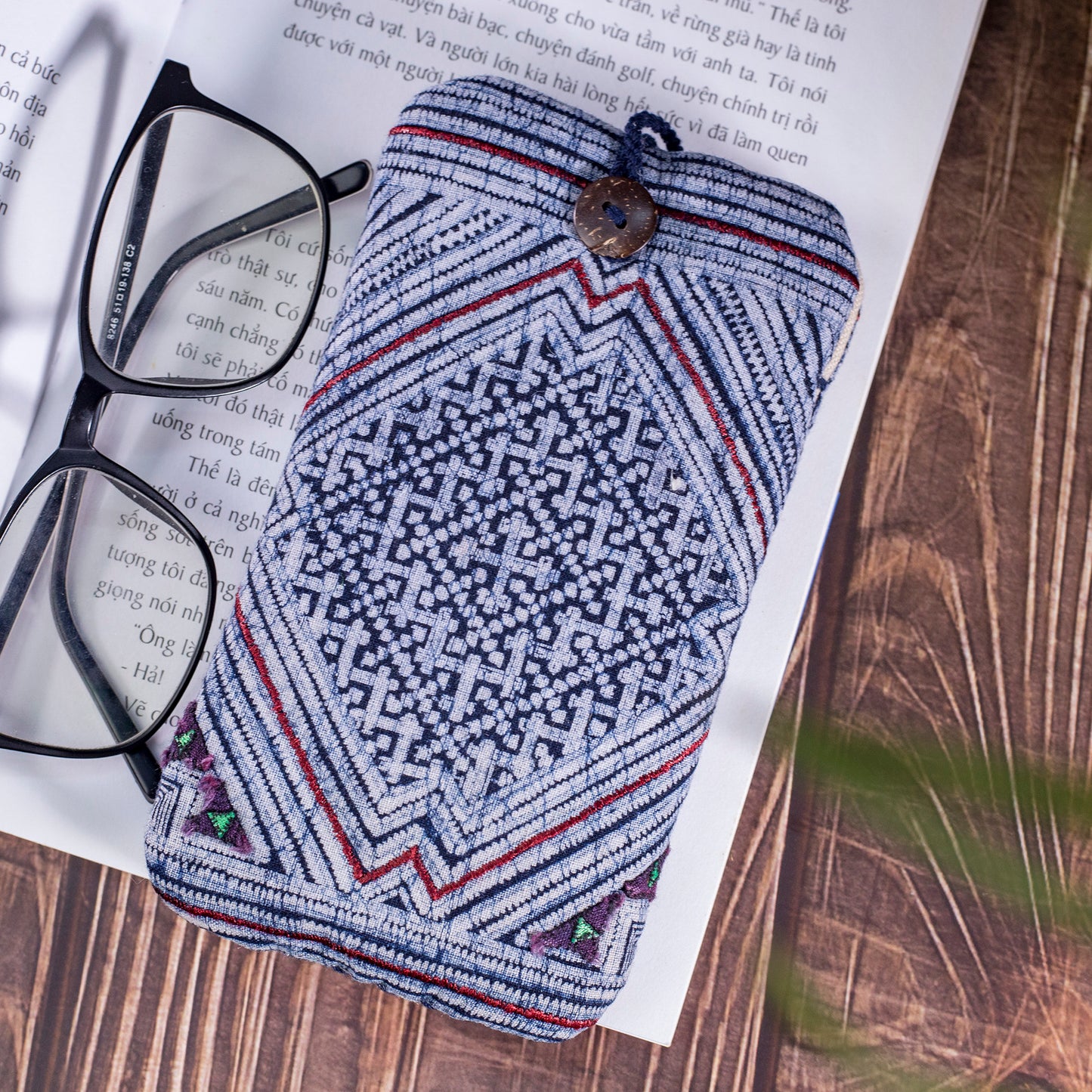 Phone case / glass case, repurposed H'mong batik fabric, shock absorption layer