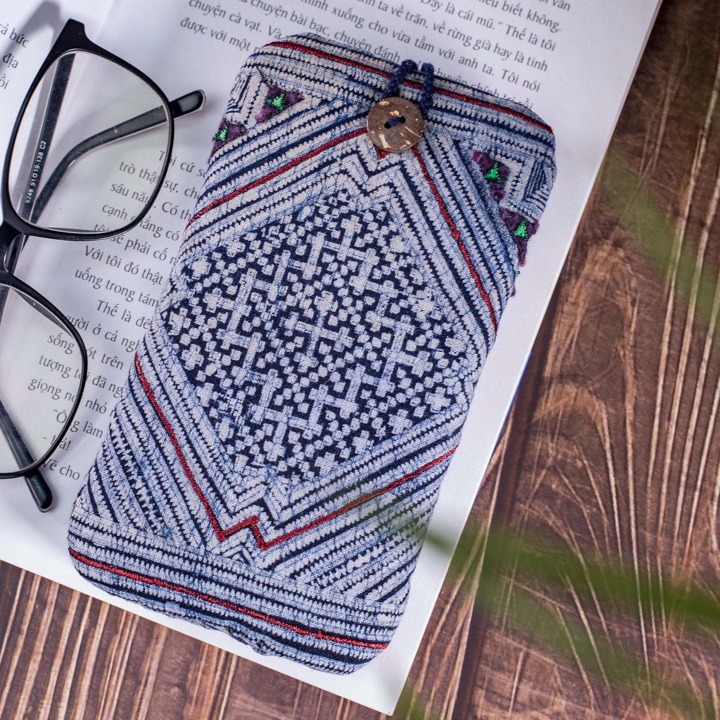 Phone case / glass case, repurposed H'mong batik fabric, shock absorption layer