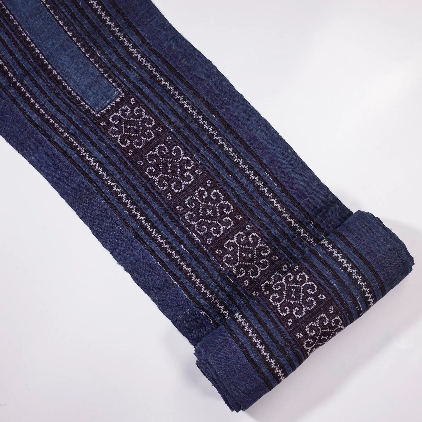 Vintage cross-stitch embroidery roll in flowery pattern
