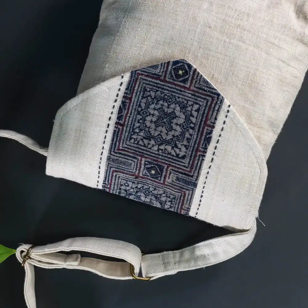 Inside view of handmade hemp handbag showing batik patch and cotton lining