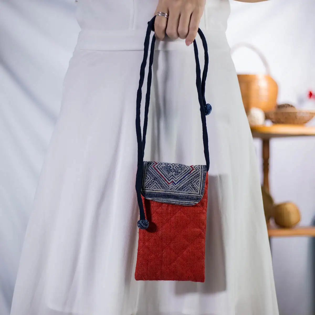 Red hemp mobilväska, small phone bag with authentic H’mong patch, artisan-made eco-friendly design.