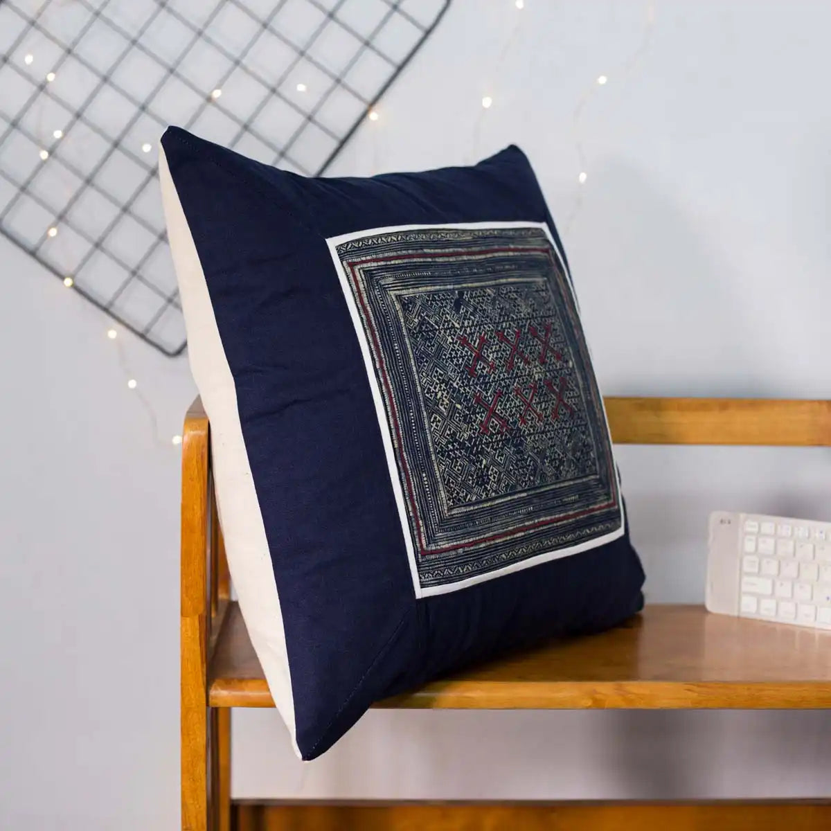 Vindigo cushion cover navy embroidered red center on chair