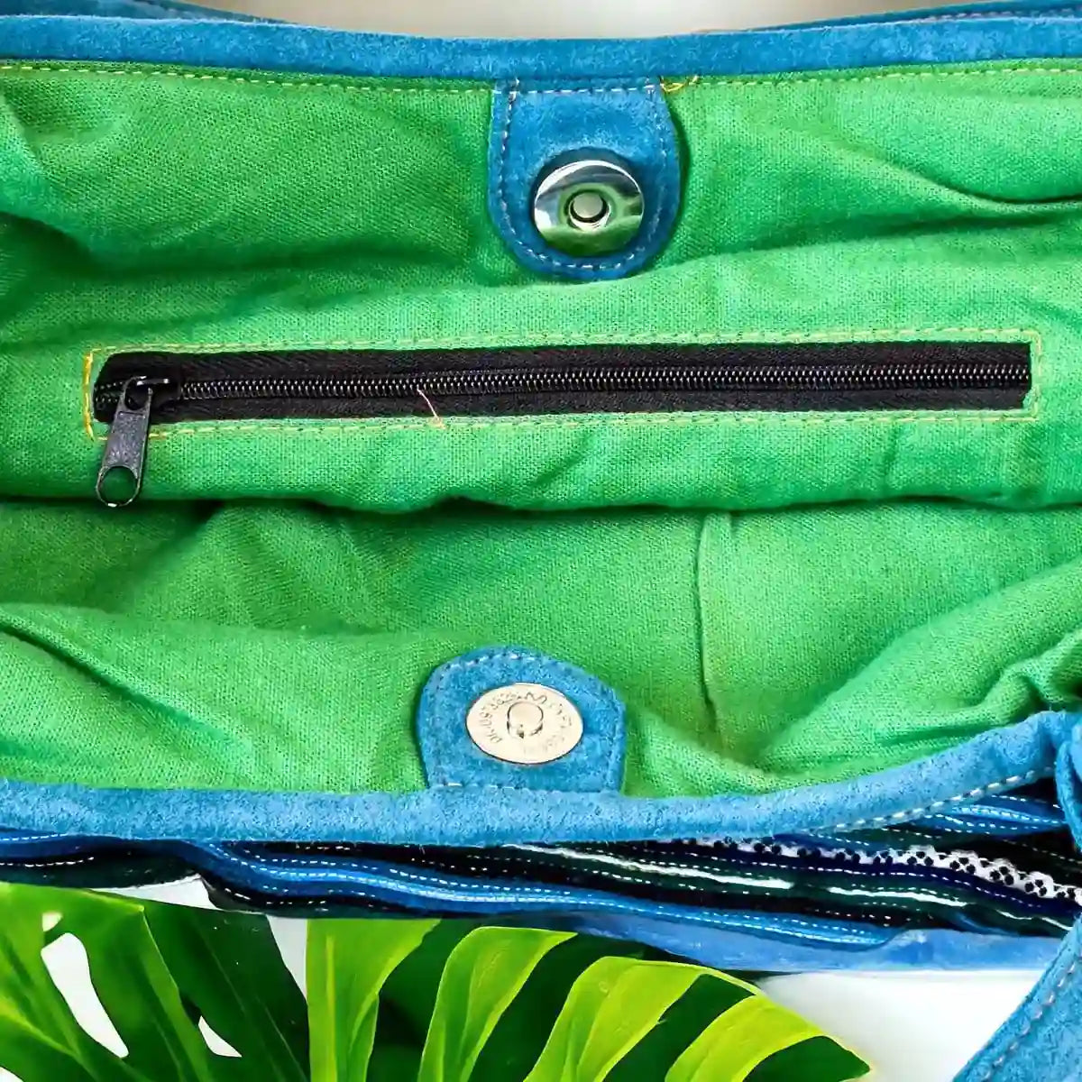 Vindigo handbag teal embroidered with green lining inside detail
