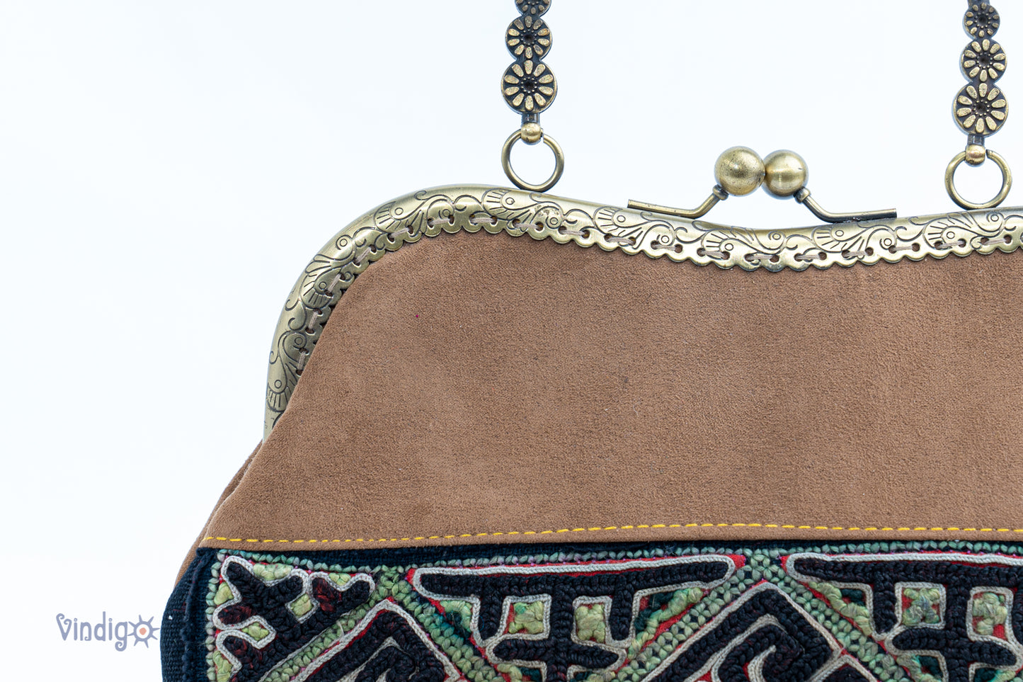 Brown faux leather bag with vintage tribal embroidery and copper-binding