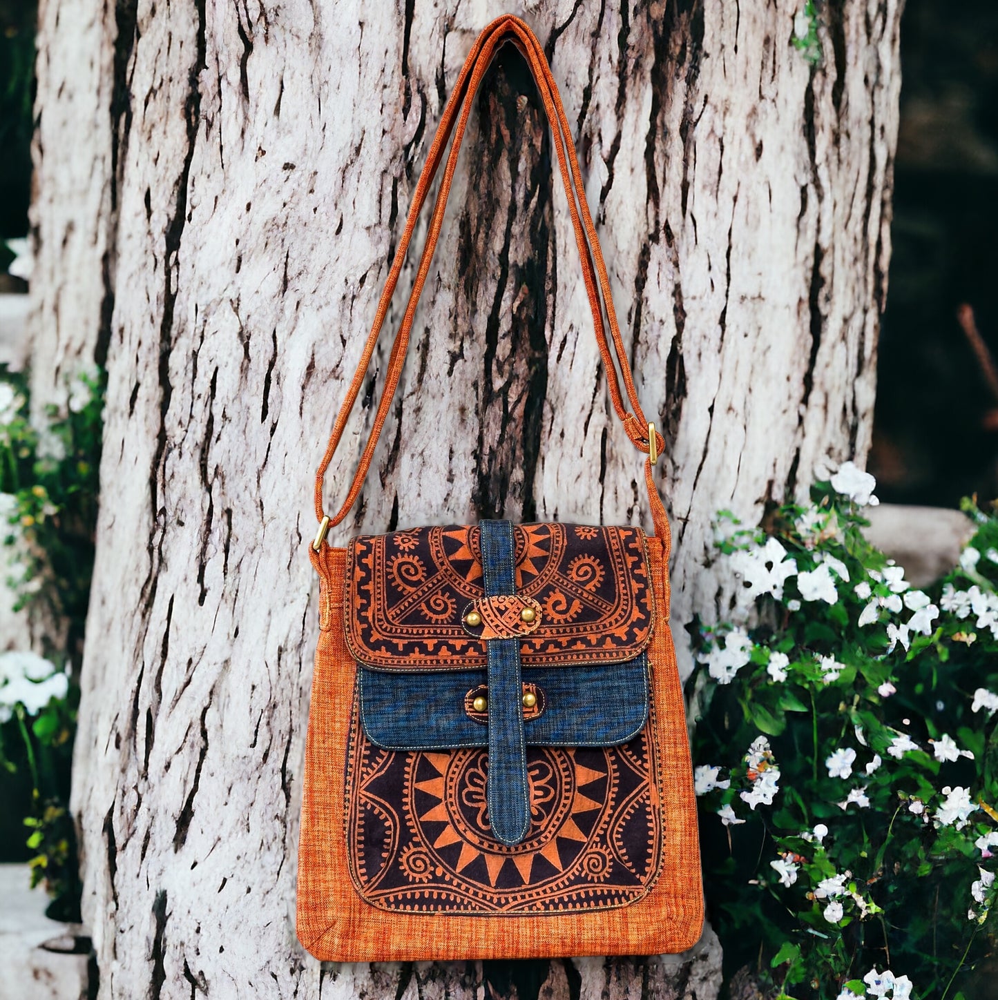 Batik cross-body bag, hand-drawn batik pattern, saffron spice orange, full sun