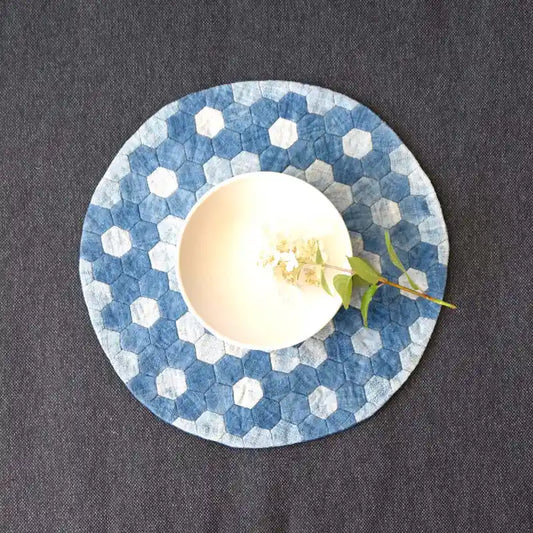 Vindigo light blue denim hexagon placemat with bowl on top