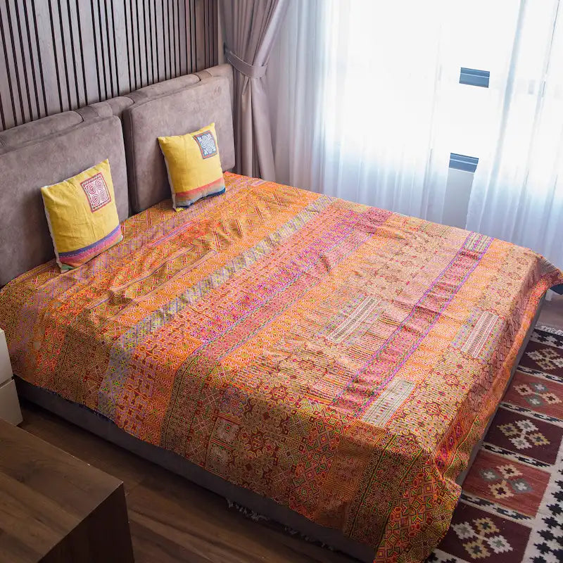 Vindigo orange cotton bed cover with Hmong embroidery lifestyle view