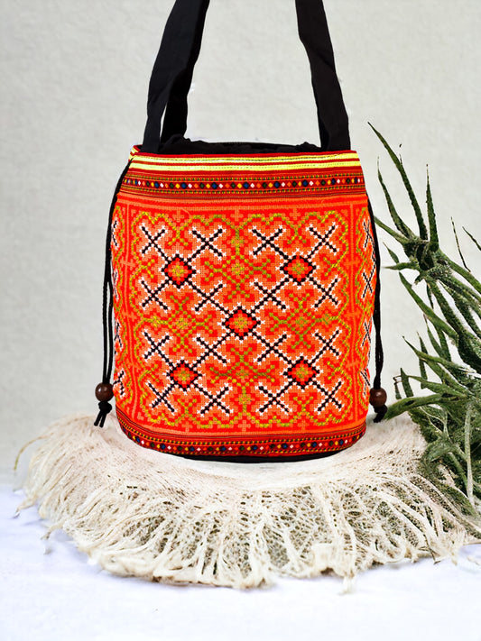 Orange embroidery shoulder bag with string to close