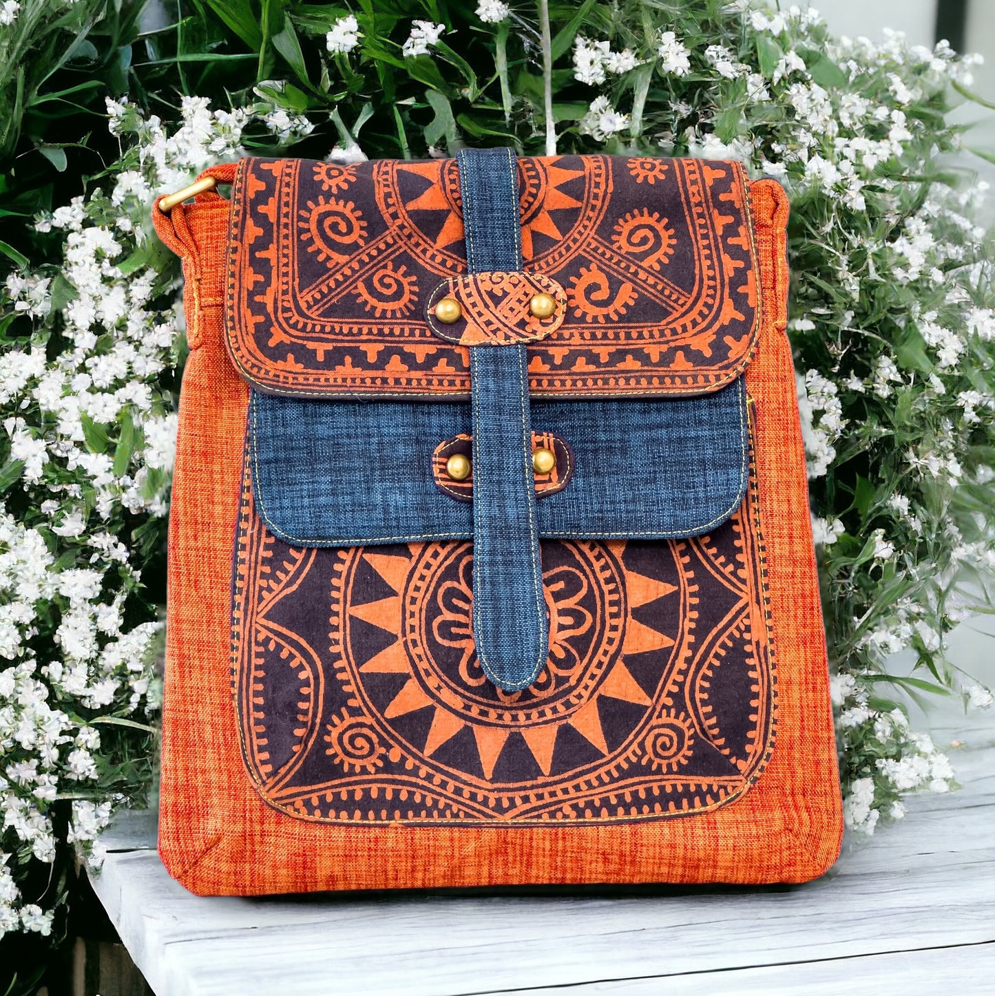 Batik cross-body bag, hand-drawn batik pattern, saffron spice orange, full sun