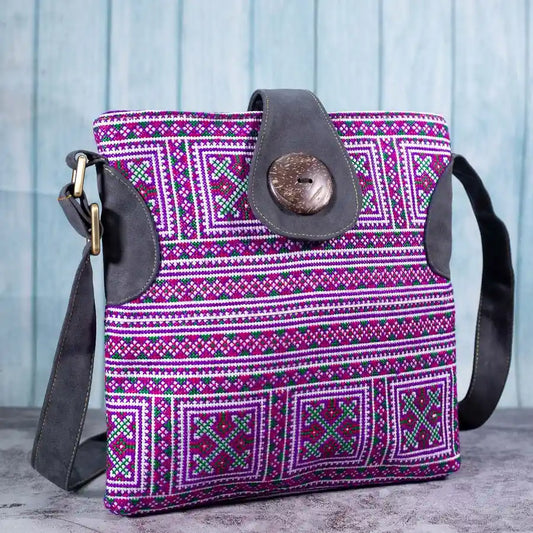 Vindigo purple embroidered crossbody bag side view with grey faux leather strap