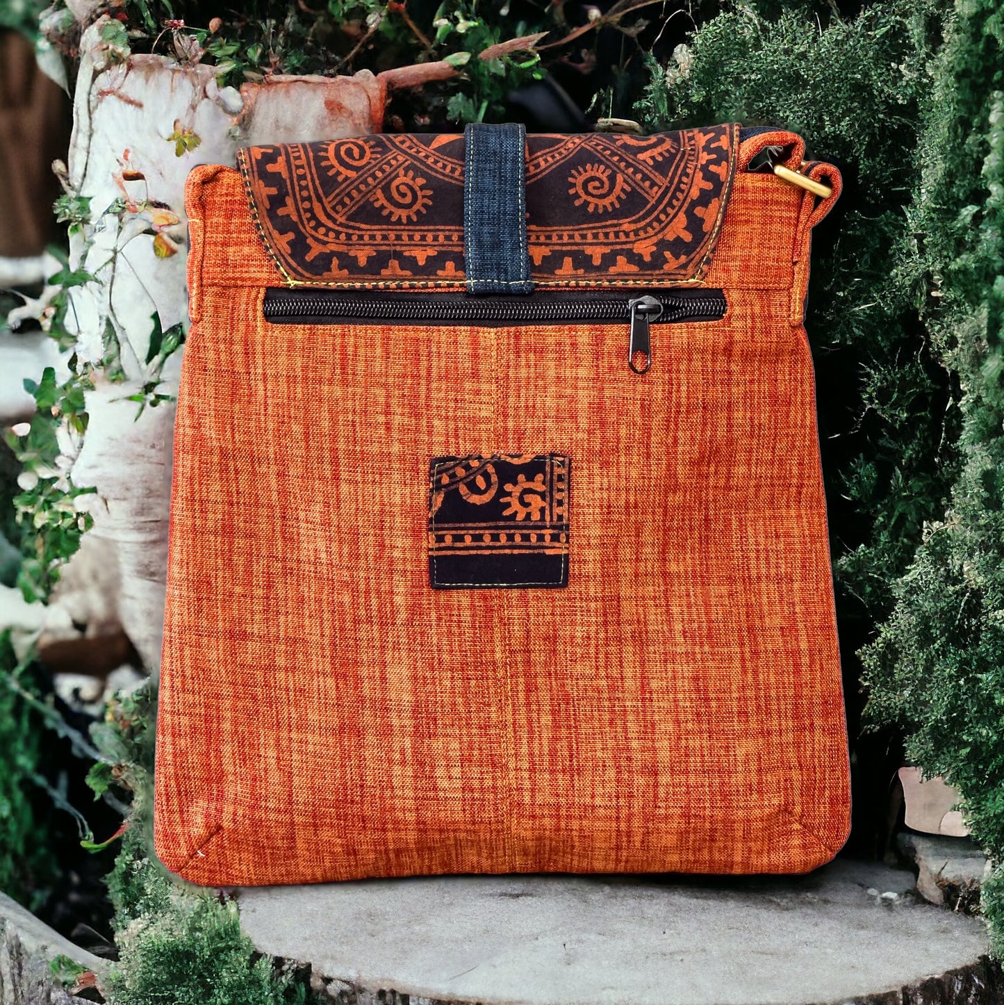 Batik cross-body bag, hand-drawn batik pattern, saffron spice orange, full sun