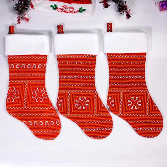 Set of red Nordic stockings in holiday scene