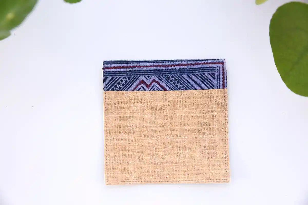 Front view of natural hemp coaster with indigo woven border