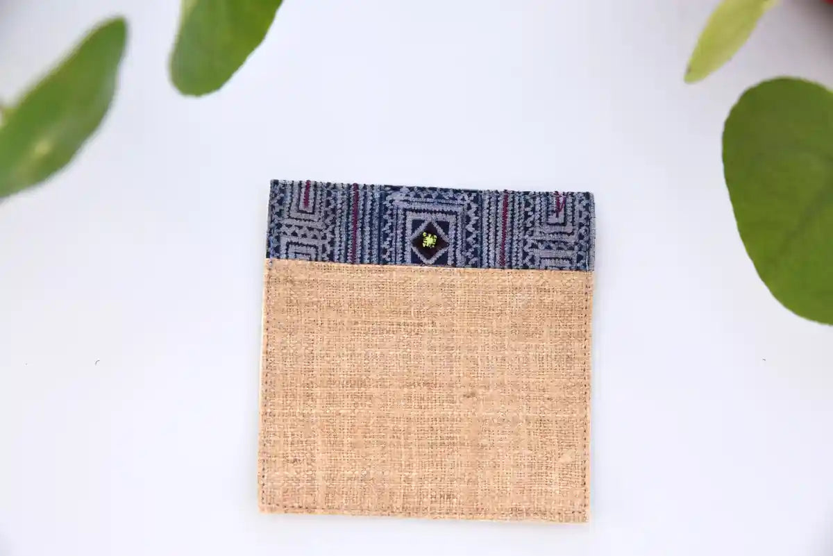 Front view of natural hemp coaster with indigo woven border
