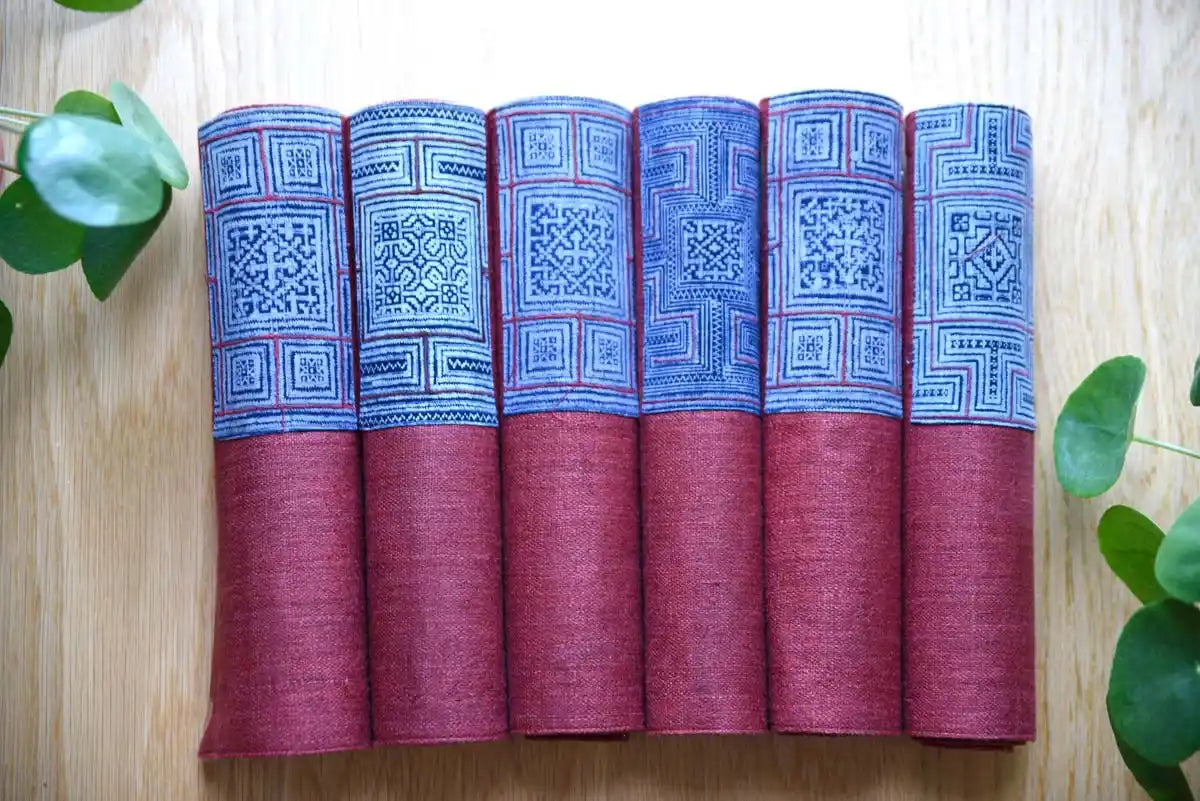 Rolled indigo hemp napkins with geometric woven pattern