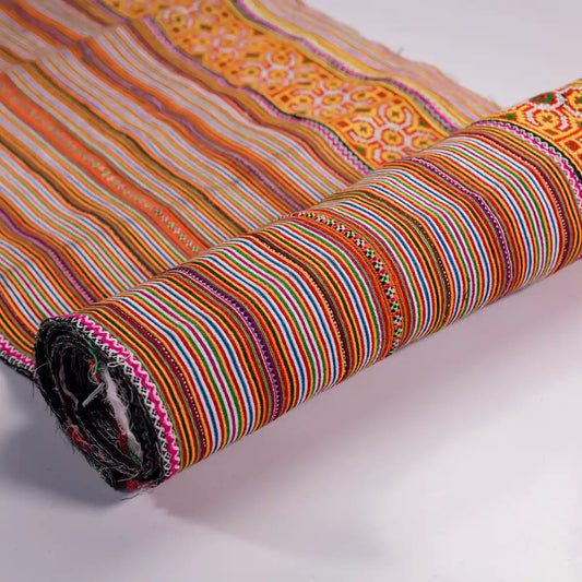 Vindigo orange cotton fabric with tribal embroidery pattern detail close-up