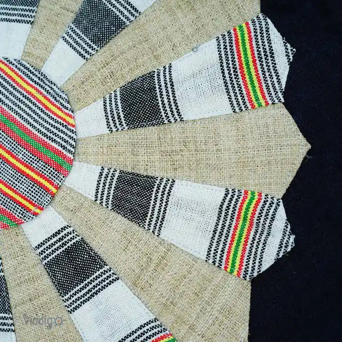 Fabric texture close-up showing colorful Dresden Plate stitching