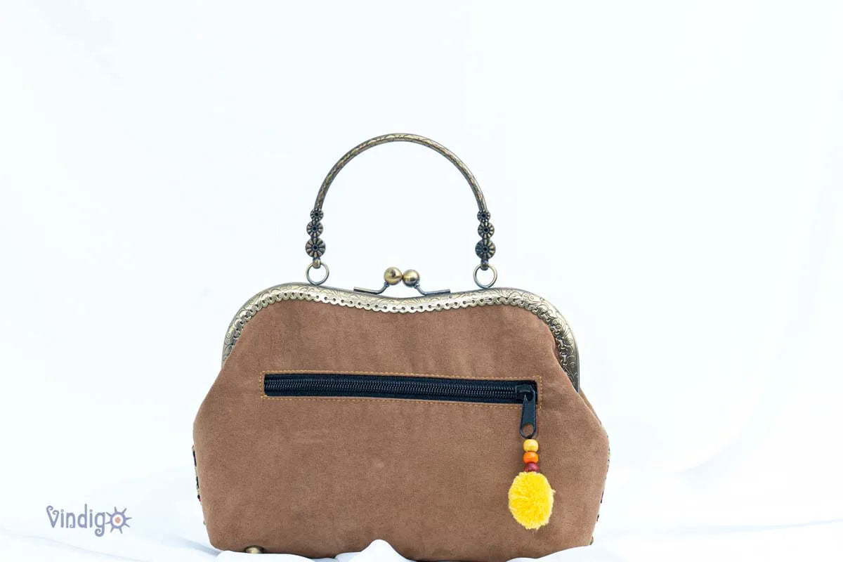 Vindigo handbag back view with faux leather and zipper pocket