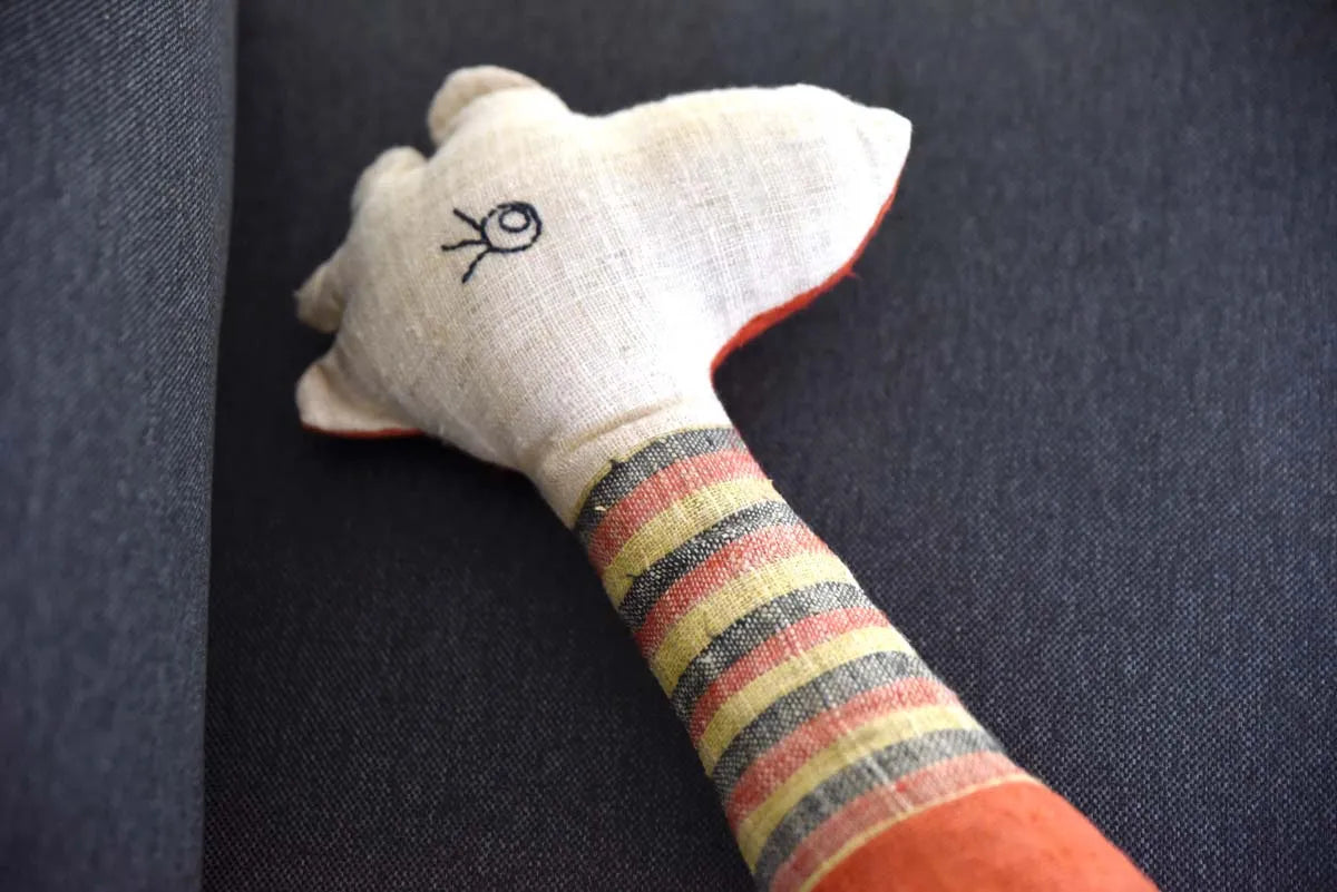 Close-up of Vindigo orange hemp deer head and striped neck