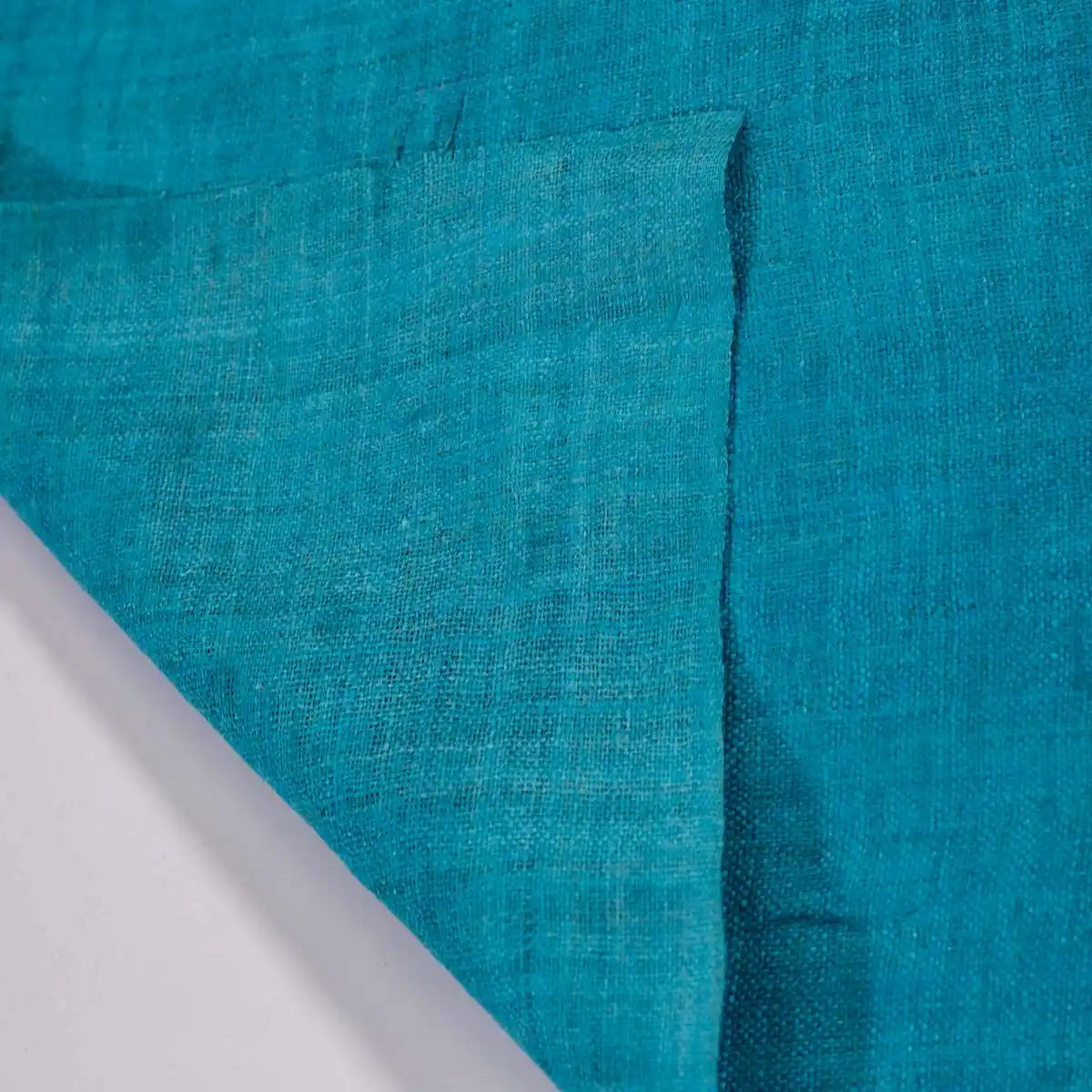 Vindigo turquoise hemp fabric roll folded side view
