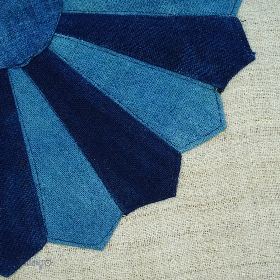 Fabric detail of indigo dresden petal stitching