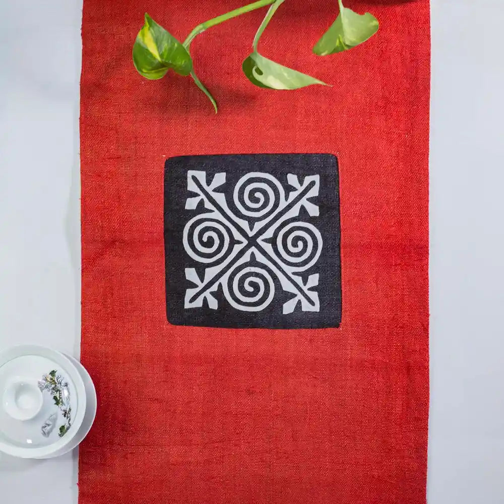 Vindigo red hemp table runner center view with hand-stitched H’mong motif