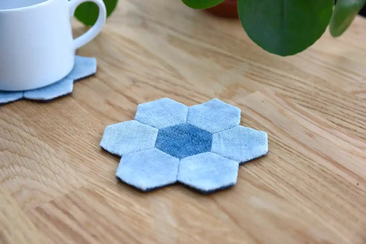 Blue denim hexagon coasters styled with cup and greenery