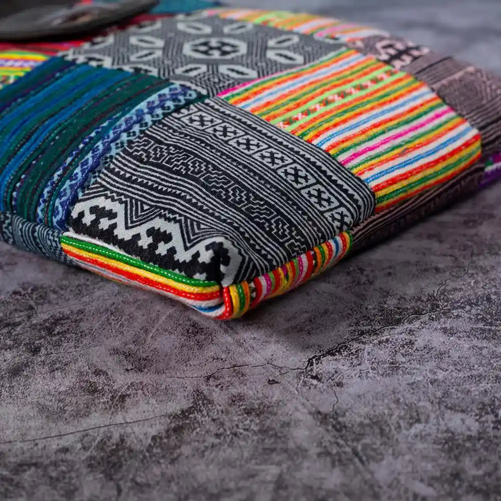 Vindigo crossbody bag bottom view with colorful H’mong patchwork patterns