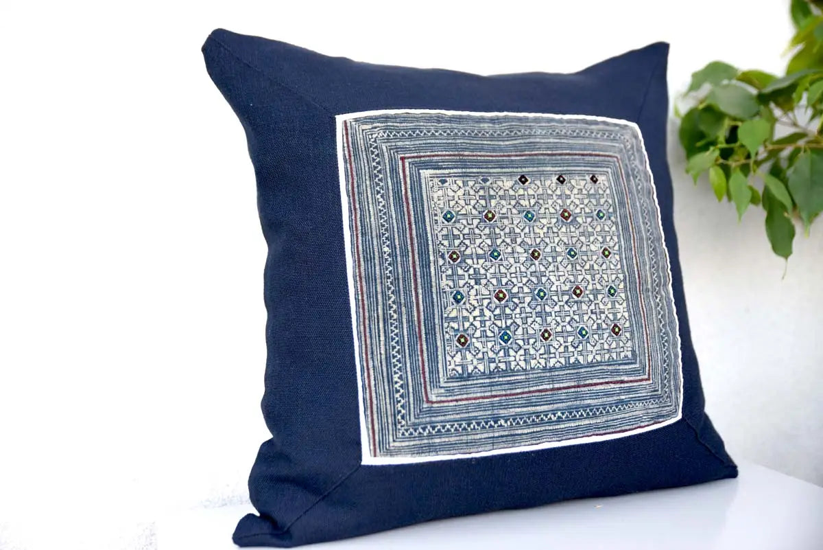 Indigo hemp cushion cover styled on sofa with greenery background