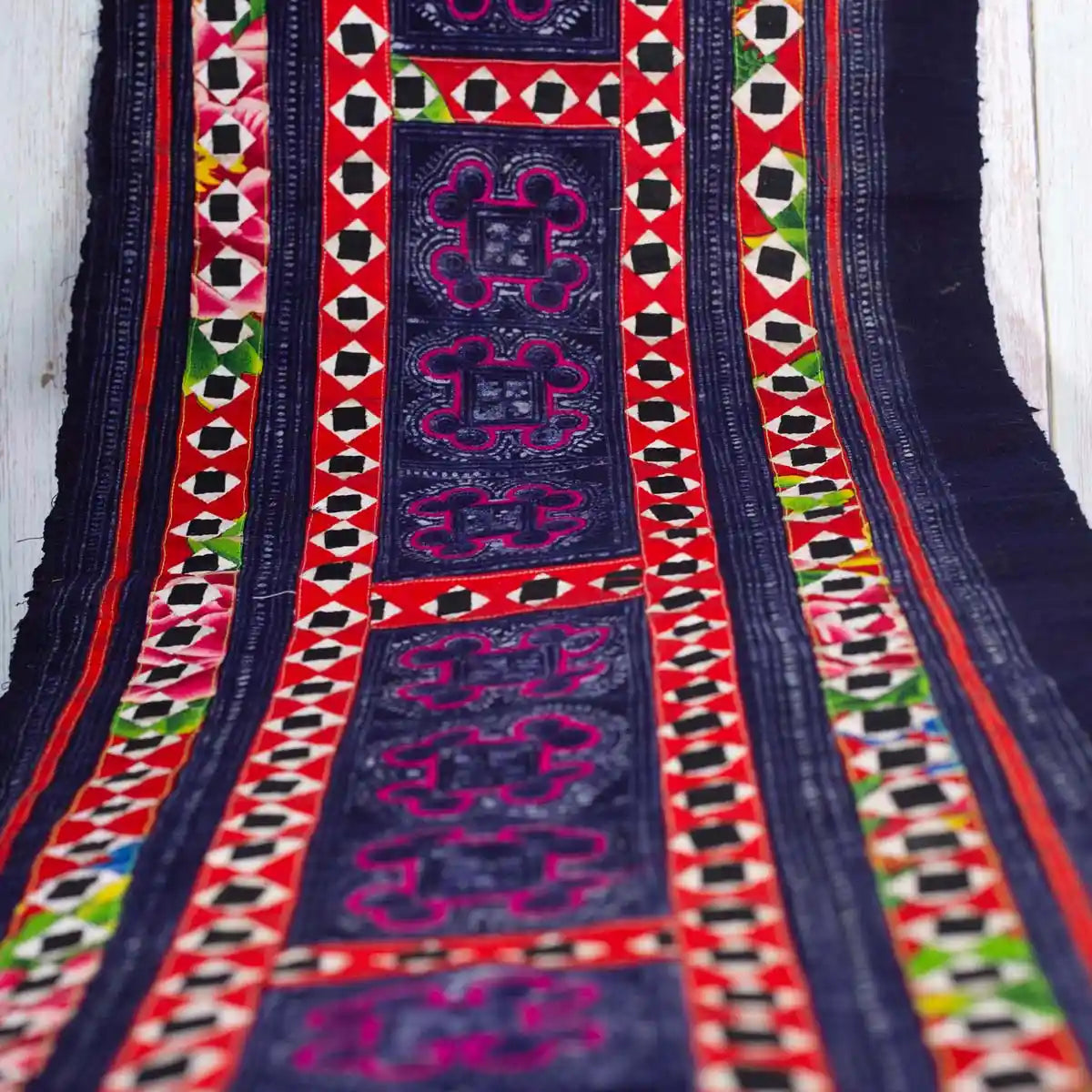 Vindigo black fabric roll with hand embroidery top-down view