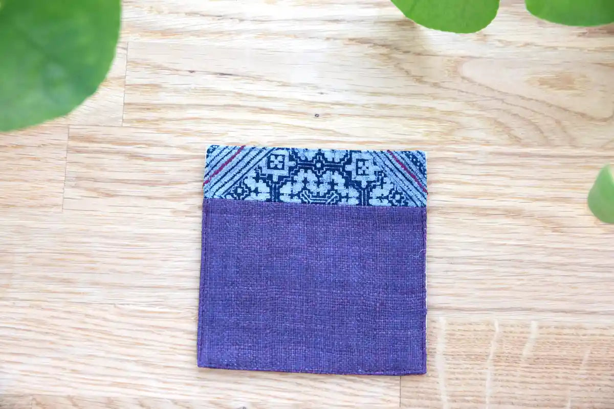 Top view of indigo hemp coaster with minimal tribal accent