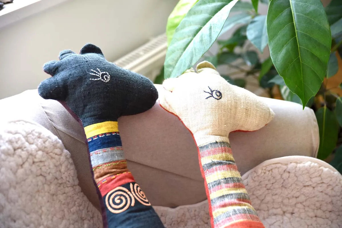 Black and white hemp deer plush set on sofa with plants