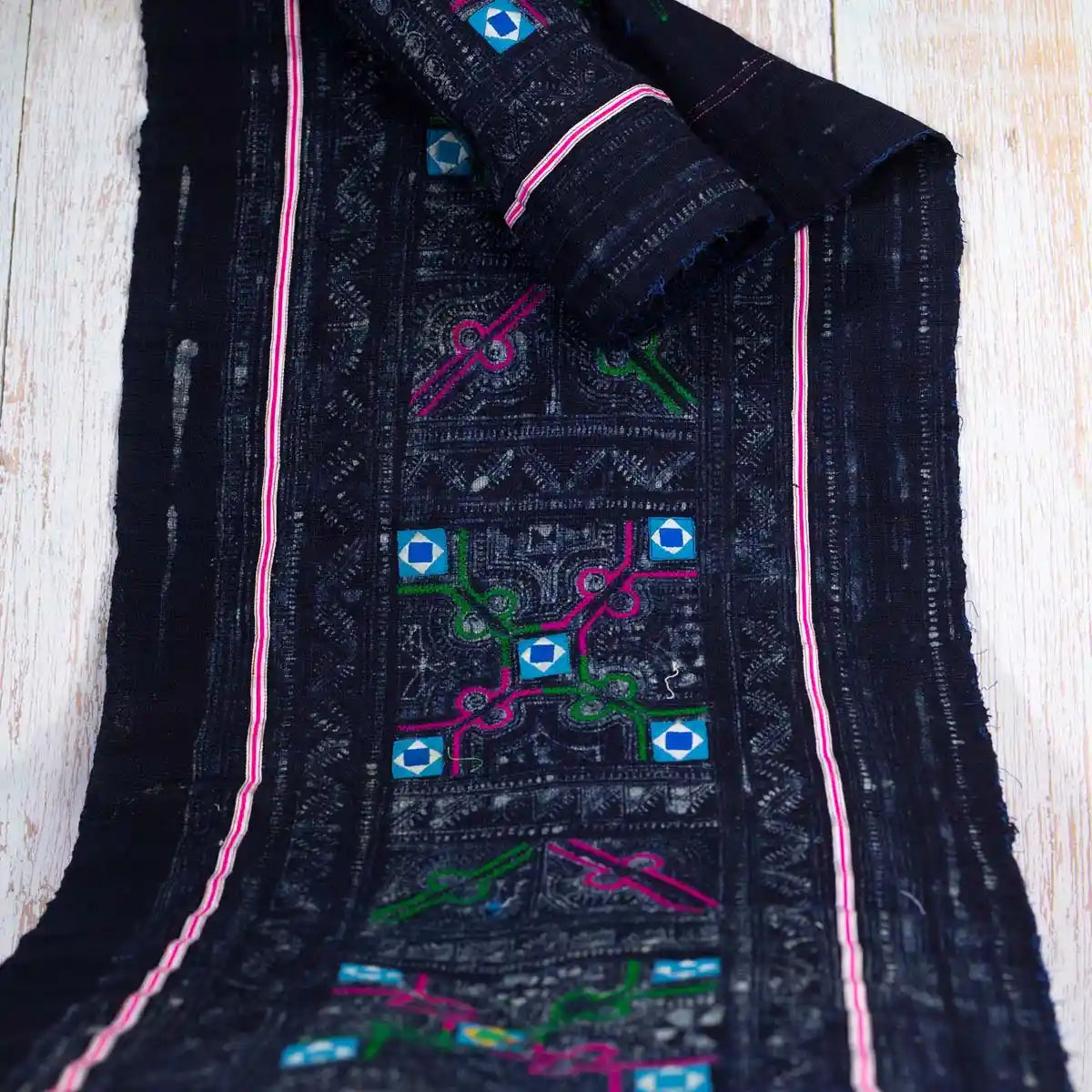 Vindigo rolled black fabric with Hmong turquoise square pattern and subtle pink border