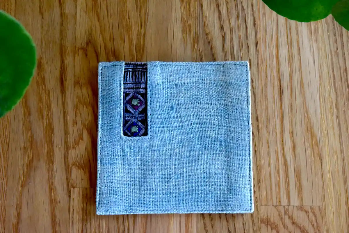 Stack of light denim coasters with indigo tribal fabric detail