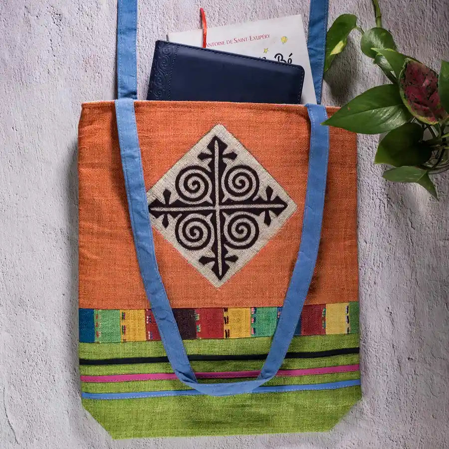 Vindigo shoulder bag orange hemp hand-embroidered spiral patch front angle