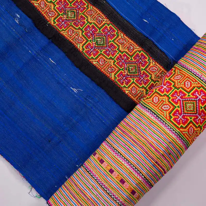 Vindigo orange cotton fabric with blue edge and tribal embroidery detail