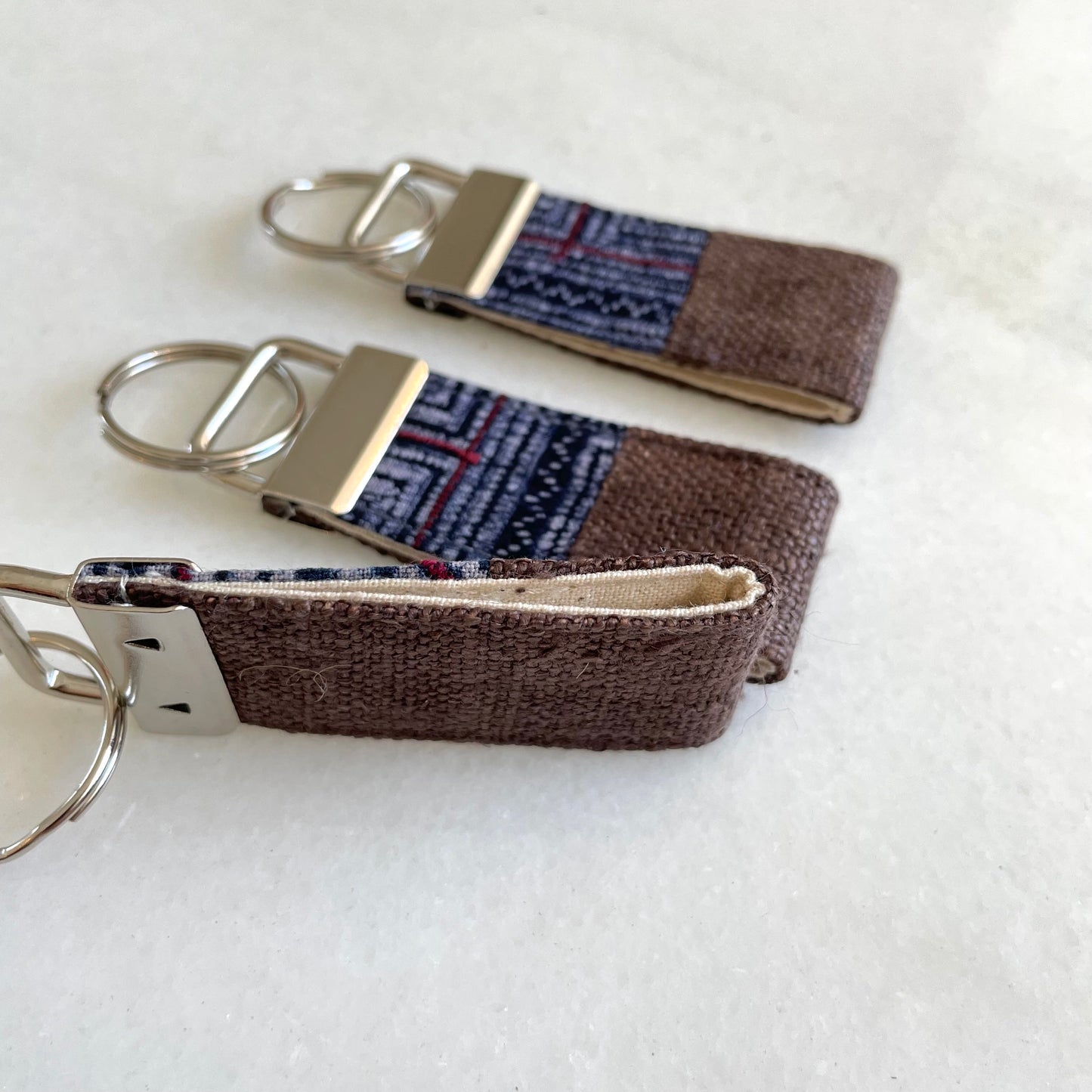 Dark brown hemp fabric keychain with vintage batik patch, stainless metal key fob