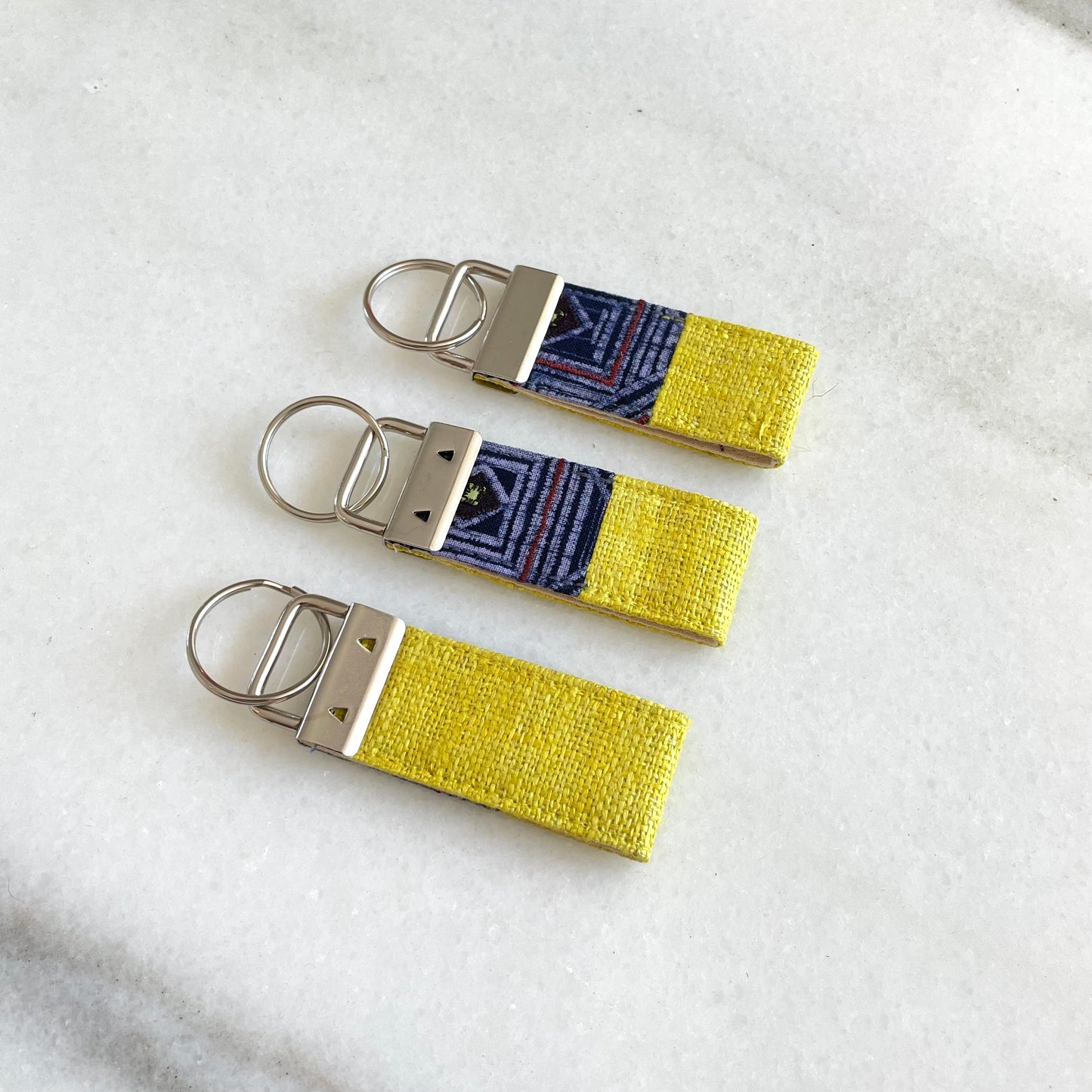 Bright yellow hemp fabric keychain with vintage batik patch, stainless metal key fob