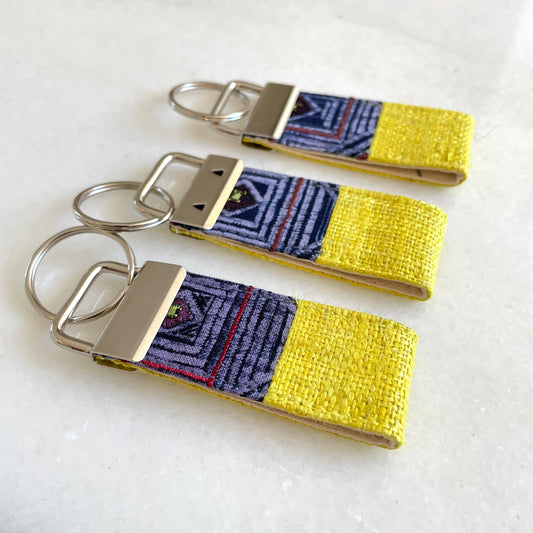 Bright yellow hemp fabric keychain with vintage batik patch, stainless metal key fob