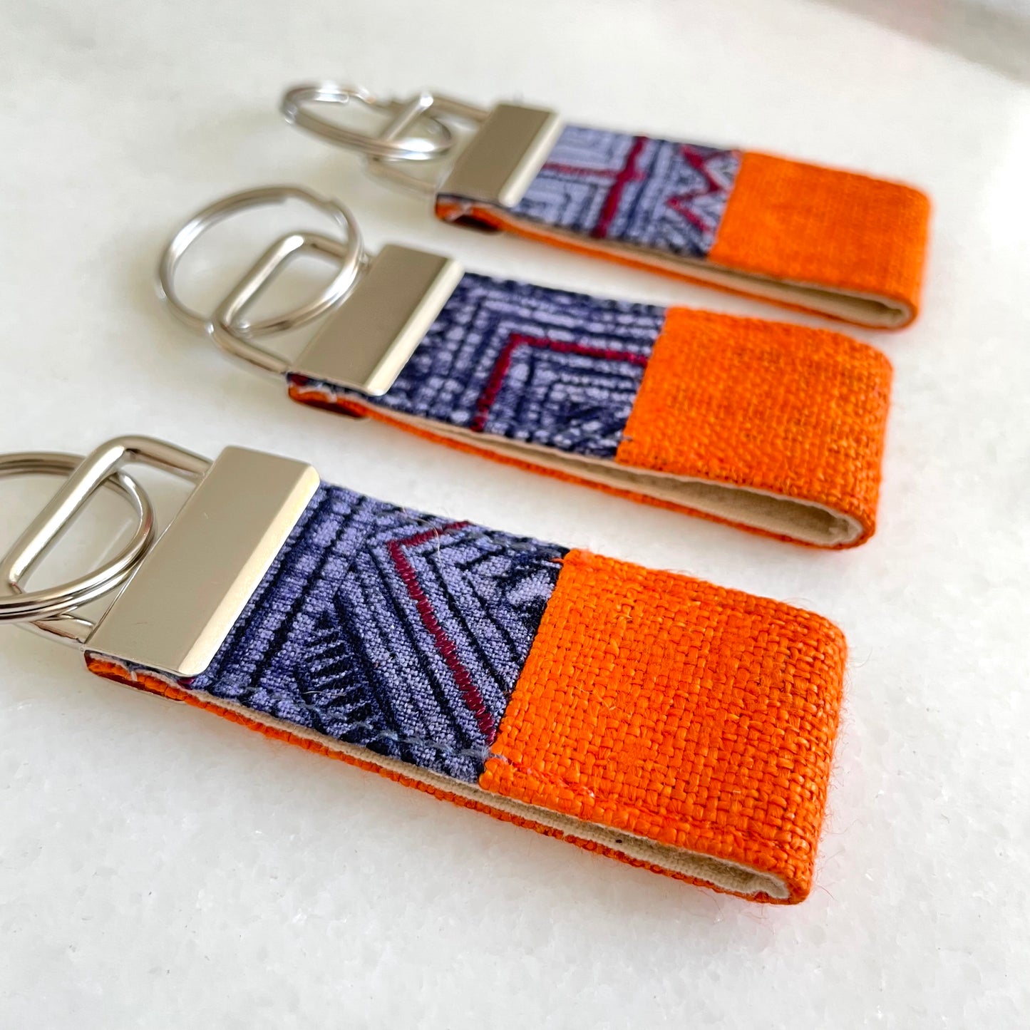 Orange hemp fabric keychain with vintage batik patch, stainless metal key fob